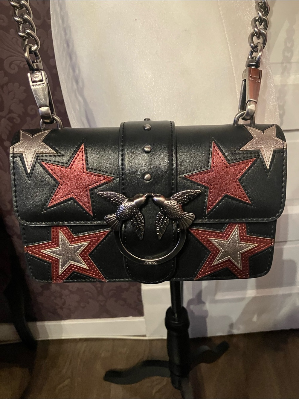 Pinko “Love” Black Leather Crossbody Bag with Red and Silver Star Appliqués